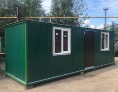 Бытовка зеленая с ЛДСП отделкой, центральный вход Бытовка зеленая с ЛДСП отделкой, центральный вход